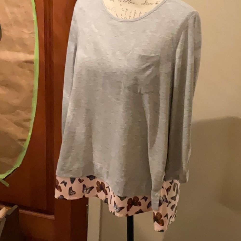 Jolt brand. Gray with assorted color butterflies on pink background